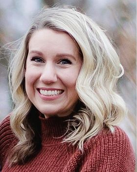 Professional headshot of Ashley Demeniuk